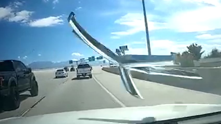 dash camera captures office chair smashing into cars windshield on interstate