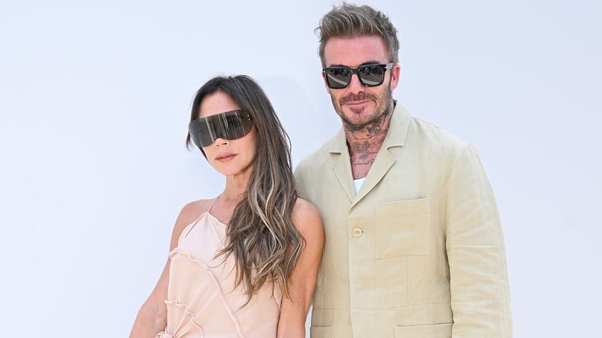 Victoria and David Beckham at a fashion show