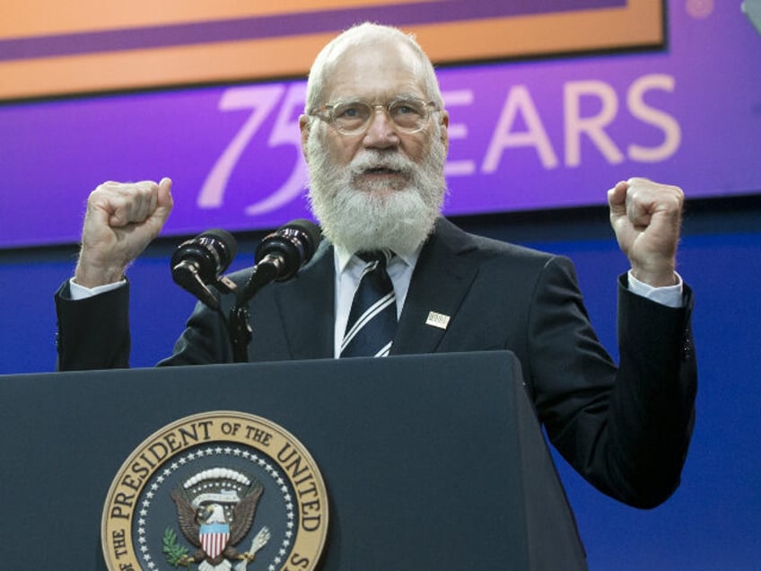 Former talk show host David Letterman speaks speaks alongside US President Barack Obama an