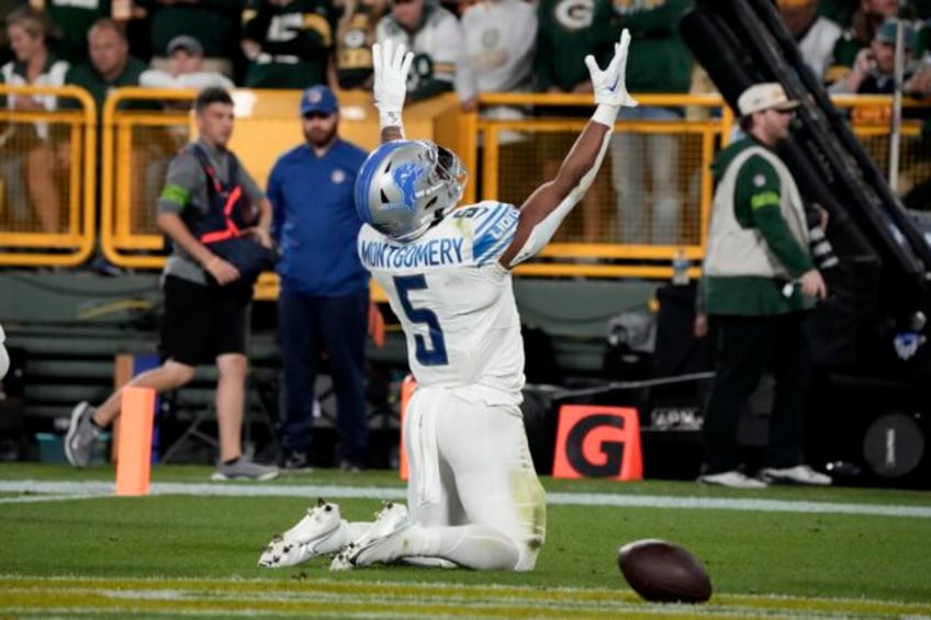 david montgomery runs wild as lions beat packers 34 20 to take early command of nfc north