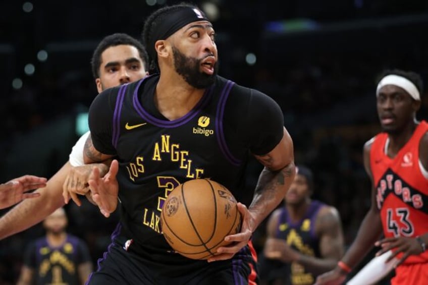 Anthony Davis's 41-point display helped the Los Angeles Lakers edge victory over Toronto on Tuesday