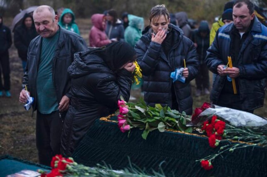 days after deadly missile strike on ukrainian cafe grief and a search for answers