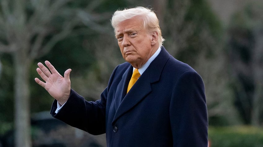 Trump waves before boarding Marine One on the White House South Lawn