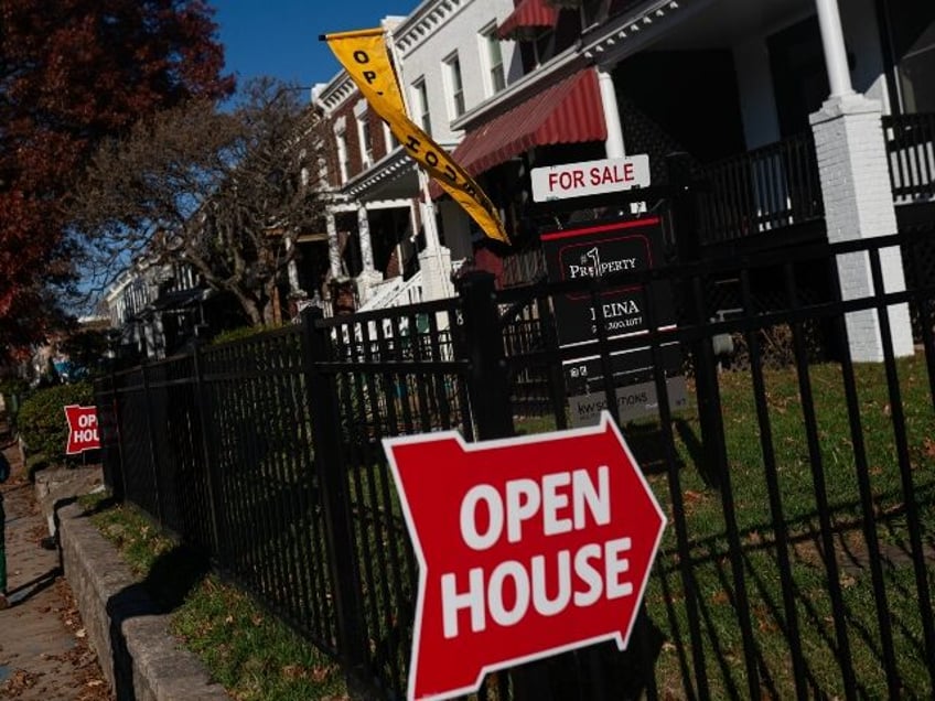 An "Open House" sign outside of a home in Washington, DC, US, on Sunday, Nov. 19