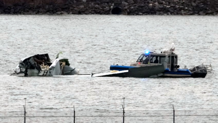 Investigators search for evidence in the DC plane crash