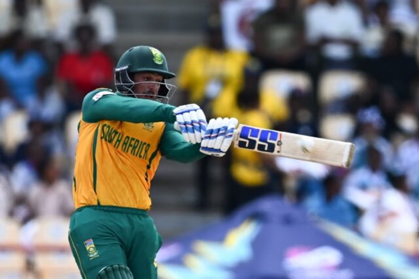 On the attack: South Africa's Quinton de Kock hits a six during his innings of 65