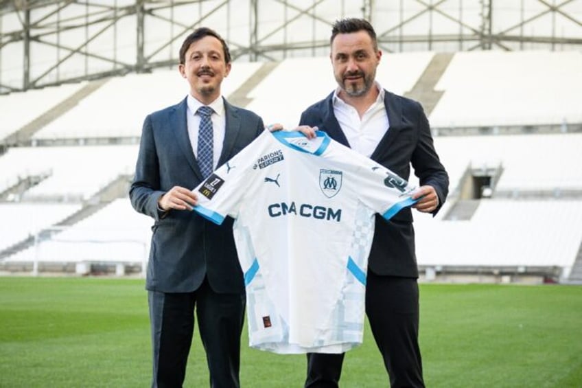 Roberto De Zerbi (R) signed a three-year contract to take over as Marseille boss last mont