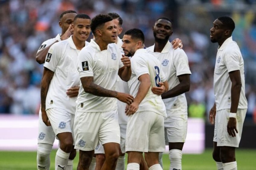 Luis Henrique (C) celebrates with teammates after scoring Marseille's second goal against