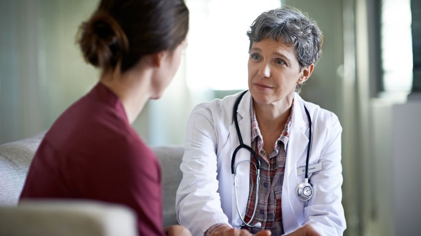 Woman getting diagnosis