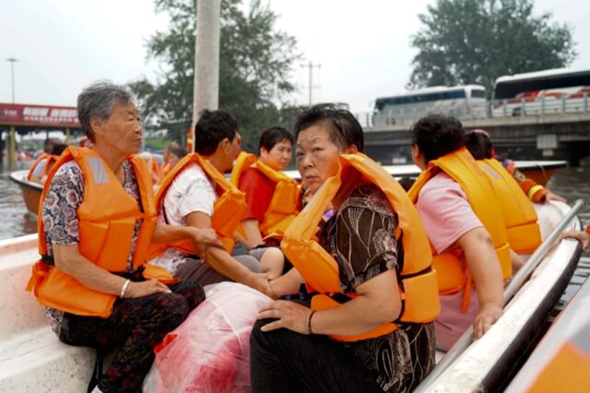 deadly flooding in china worsens as rescues and evacuations intensify