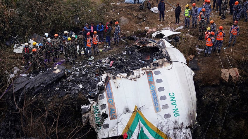 NEPAL PLANE CRASH CREWS AT WRECKAGE