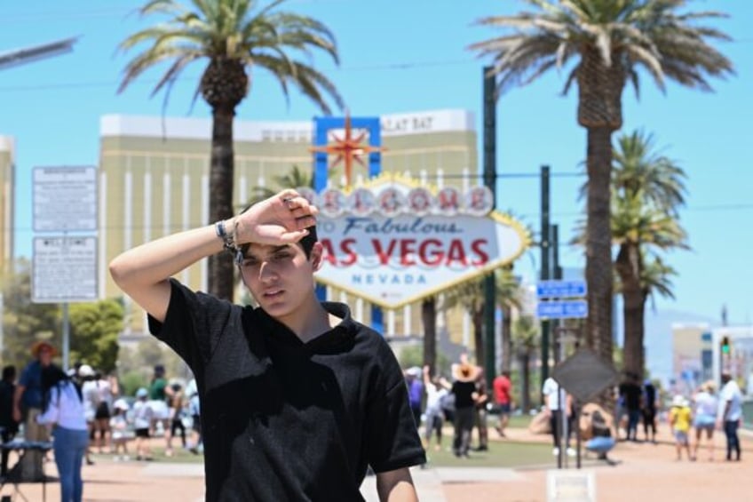 A man walks near the Las Vegas strip during a heatwave in Las Vegas, Nevada, on July 7, 20