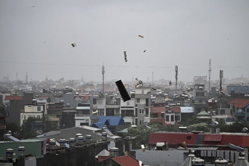 Debris flies through the air in Hai Phong as Super Typhoon Yagi makes landfall in Vietnam