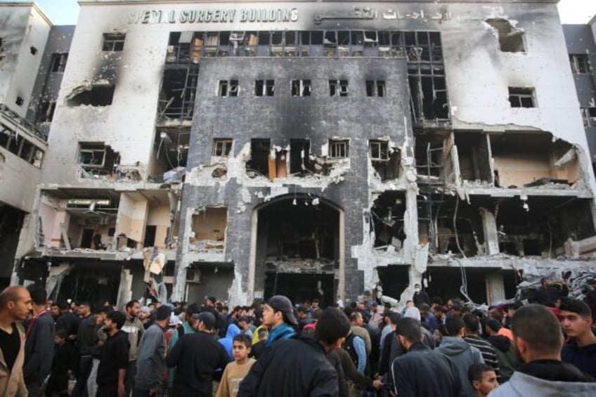 Palestinians gathered to inspect the damage to Gaza's Al-Shifa hospital after the Israeli