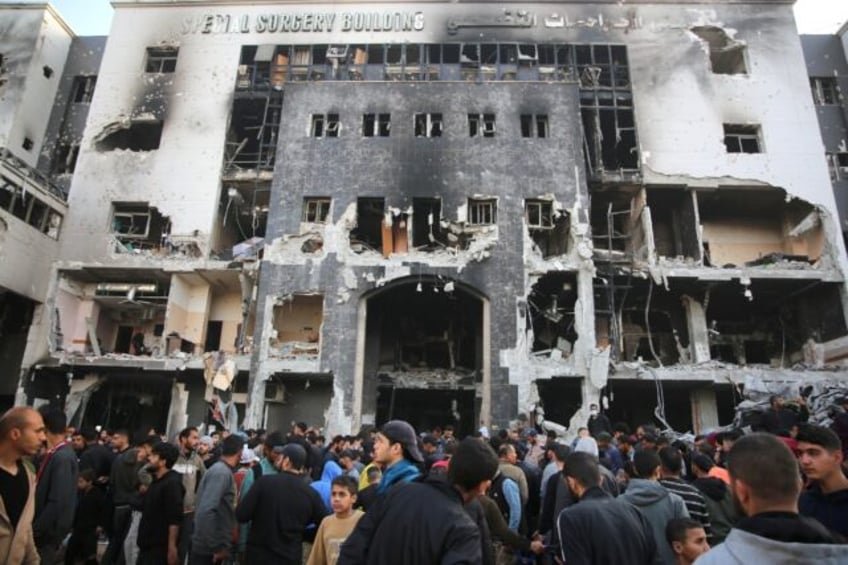 Palestinians gathered to inspect the damage to Gaza's Al-Shifa hospital after the Israeli