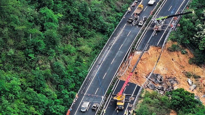 An aerial photo shows rescuers work at the site of a collapsed road section of the Meizhou-Dabu Expressway in Meizhou, south China's Guangdong Province.