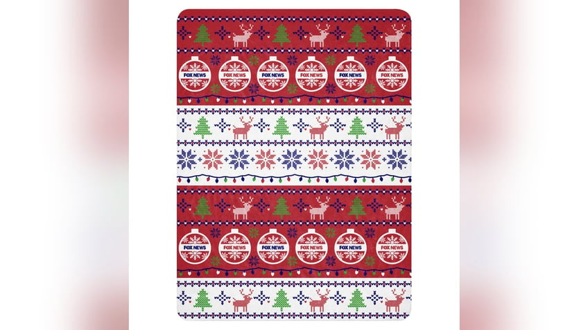 Stay warm and cozy with this super soft Christmas blanket. 