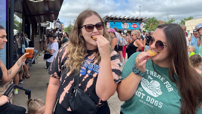 Two women eating Deep-Fried Ranch.