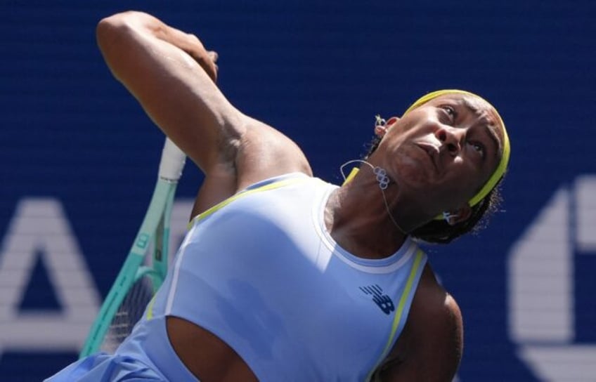 Defending champion Coco Gauff serves on the way to a US Open first-round victory over Varv