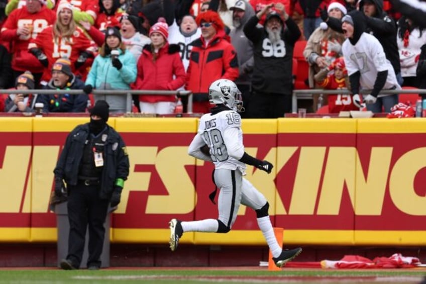 Jack Jones of the Las Vegas Raiders returns an interception for a touchdown in the Raiders' NFL victory over the Kansas City Chiefs