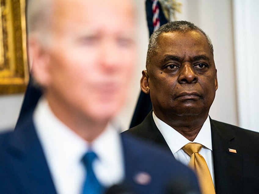 United States Secretary of Defense Lloyd Austin listens to US President Joe Biden deliver