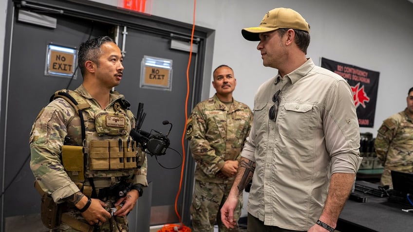 Defense Secretary Pete Hegseth seen greeting troops at Guantanamo Bay, Cuba.