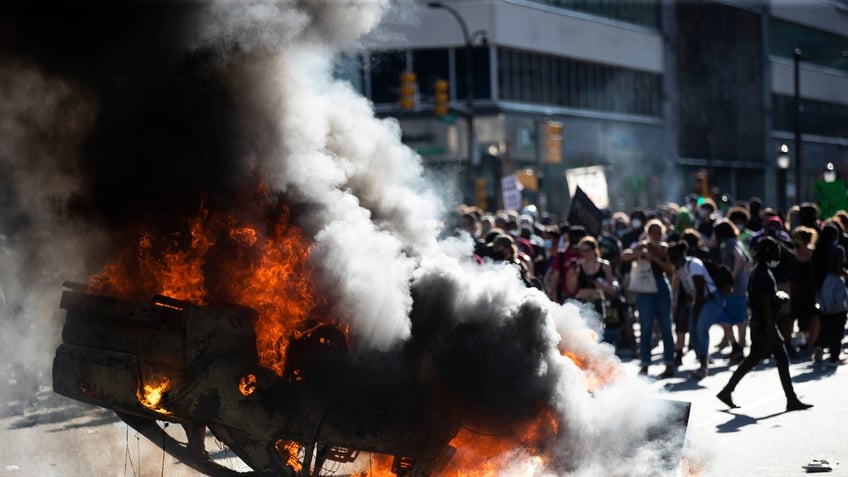 police car set on fire during george floyd riot