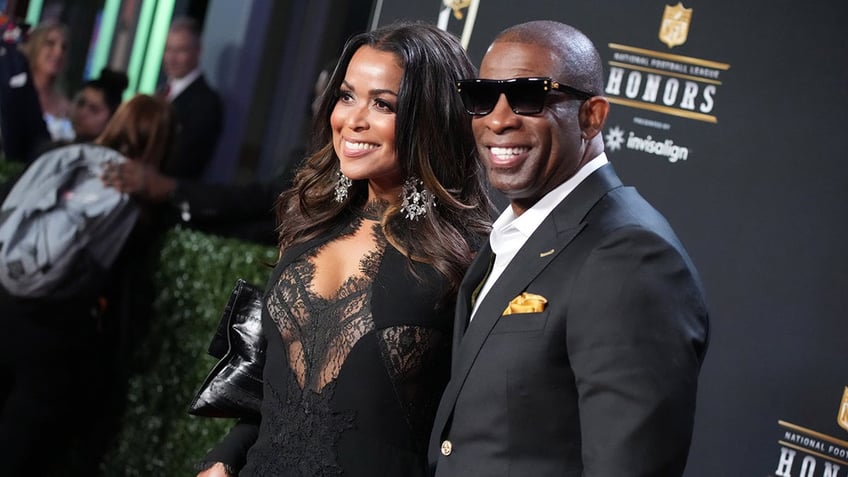 Tracey Edmonds and Deion Sanders attend an event