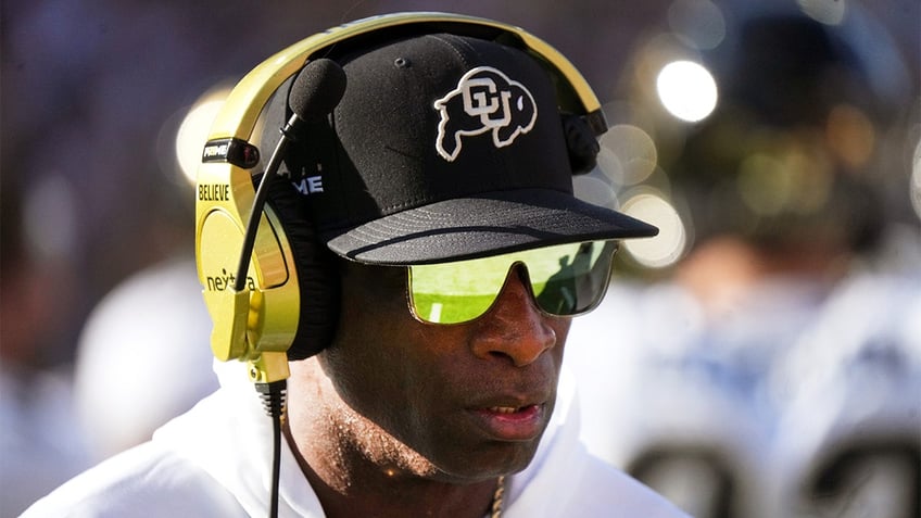 Deion Sanders walks the sidelines