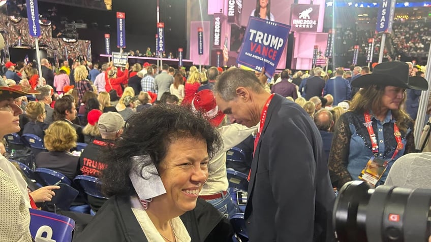 woman delegate with ear bandage