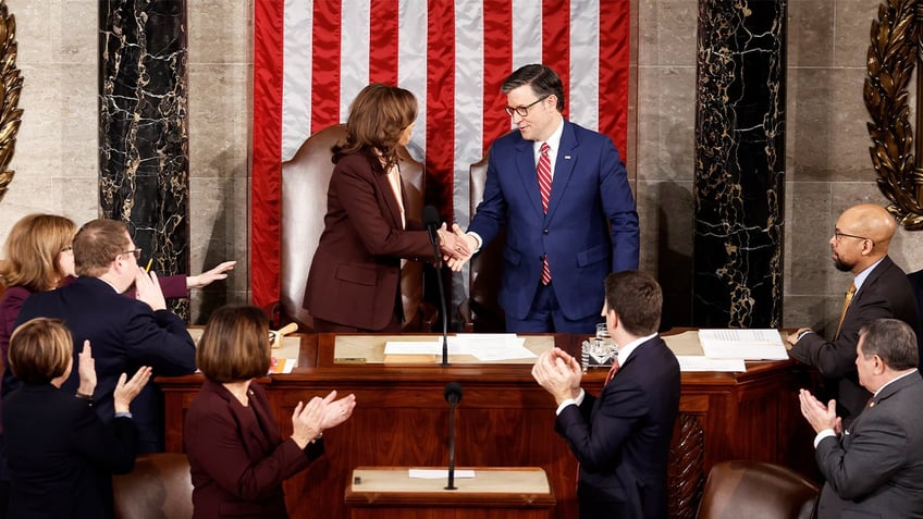 Harris and Johnson shake hands