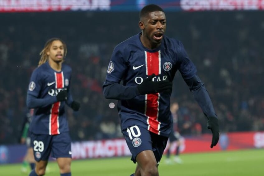 Ousmane Dembele (R) celebrates after scoring the opening goal in Paris Saint-Germain's 2-1