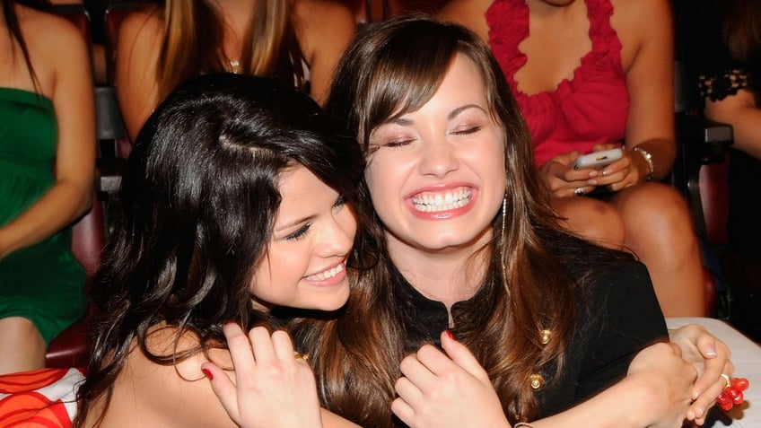 Selena Gomez and Demi Lovato hug in 2008