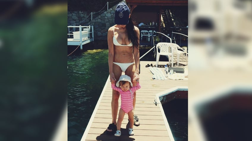 Demi Moore rocks white bikini on the river.