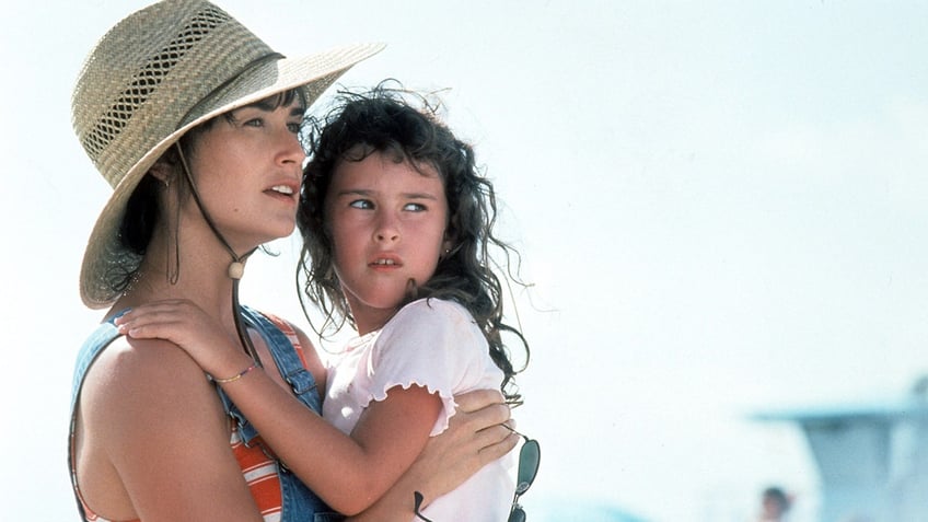 Demi Moore and daughter in "Striptease"