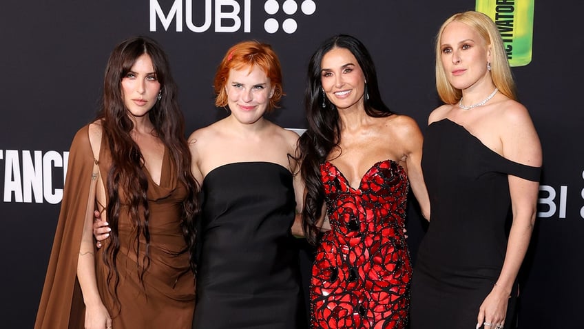 Scout LaRue Willis, Tallulah Willis, Demi Moore and Rumer Willis posing together at The Substance premiere