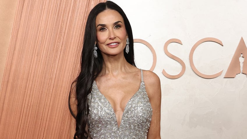 Demi Moore in a silver dress at the Academy Awards.