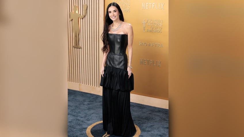 Demi Moore smiles on red carpet at Screen Actors Guild Awards.