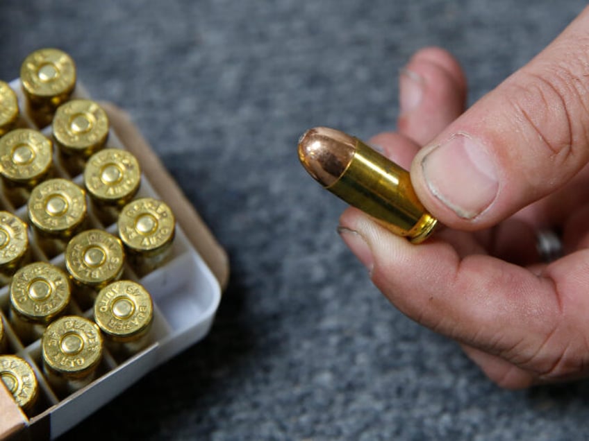 FILE - In this June 11, 2019, file photo, Chris Puehse, owner of Foothill Ammo, displays .