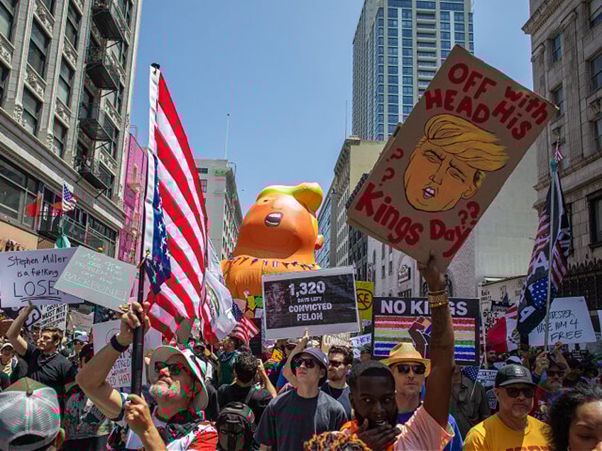 LOS ANGELES, CALIFORNIA - JUNE 14: Demonstrators march downtown against U.S. President Don