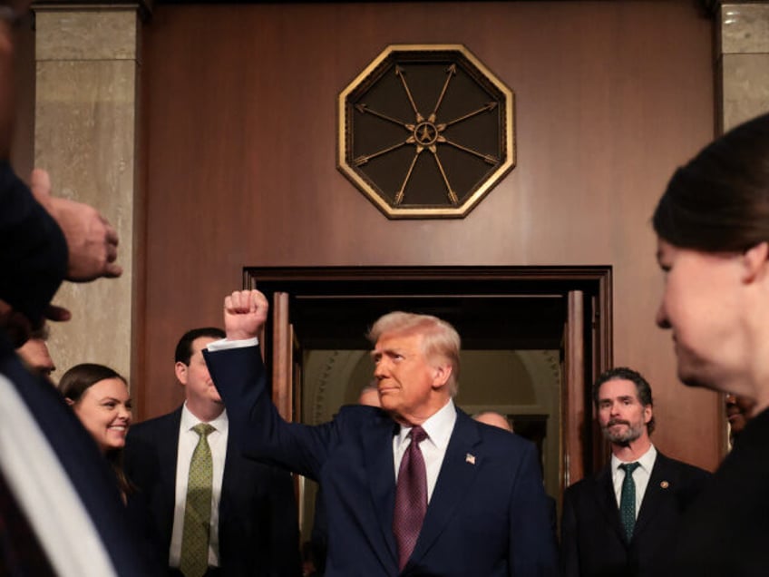 US President Donald Trump enters the US House chamber before he addresses a joint session