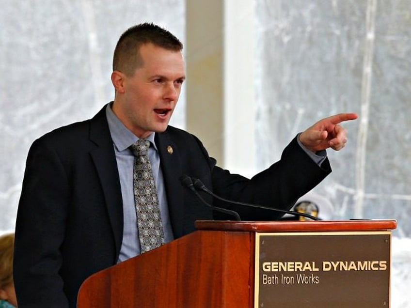 U.S. Rep. Jared Golden, D-Maine, speaks ceremony for a Zumwalt-class guided missile destroyer named for former President Lyndon Baines Johnson, Saturday, April 27, 2019, in Bath, Maine. (AP Photo/David Sharp)