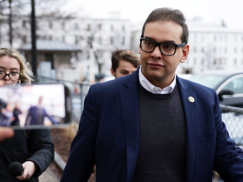 WASHINGTON, DC - JANUARY 31: U.S. Rep. George Santos (R-NY) leaves the Capitol Hill Club as members of the press follow him on January 31, 2023 in Washington, DC. Amid ongoing investigations into his finances, campaign spending and false statements on the campaign trail, Santos is reportedly recusing himself from his House committee assignments. (Photo by Alex Wong/Getty Images)