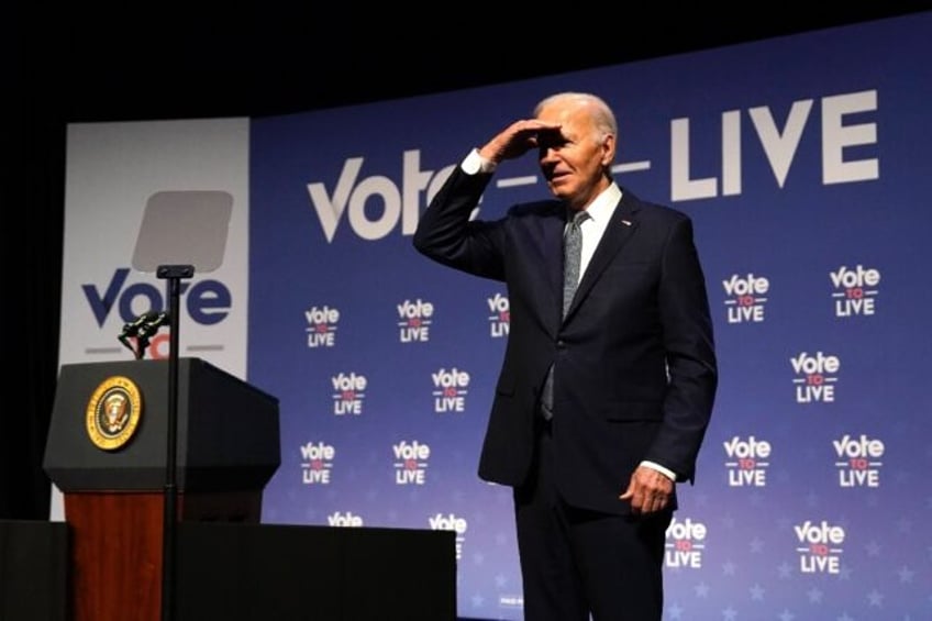 US President Joe Biden gestures near the podium during the Vote To Live Properity Summit i