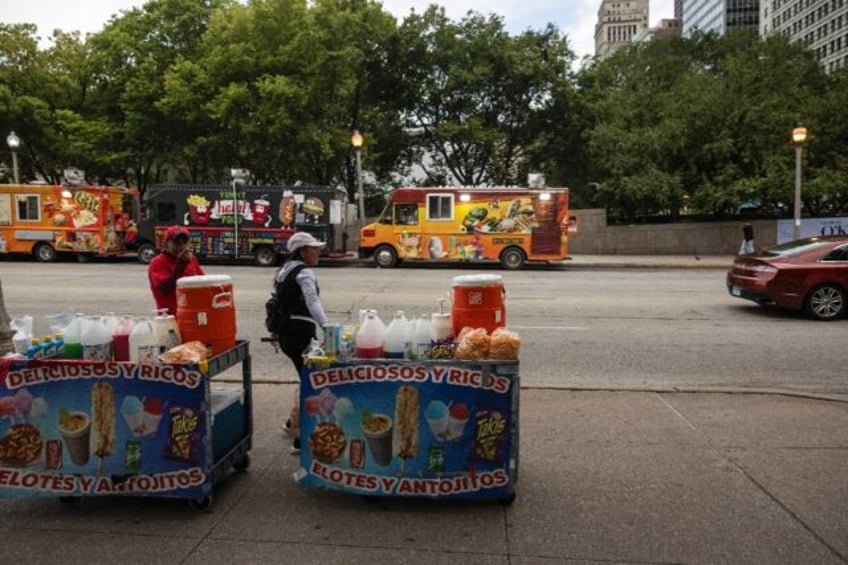 Migrants from Ecuador sell goods in Chicago -- migrants often have to wait months before t