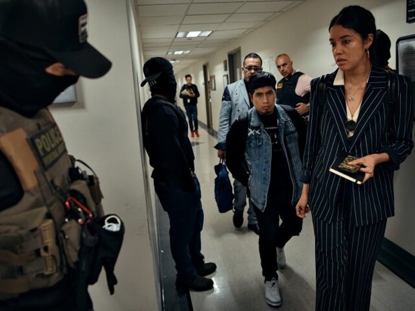 NEW YORK, NEW YORK - JUNE 11: Federal agents prepare to approach and detain a person, cent