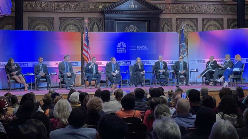 The eight candidates vying for Democratic National Committee chair sit for a forum that was repeatedly interrupted by protesters, at Georgetown University in Washington, D.C., on Jan. 30, 2025.