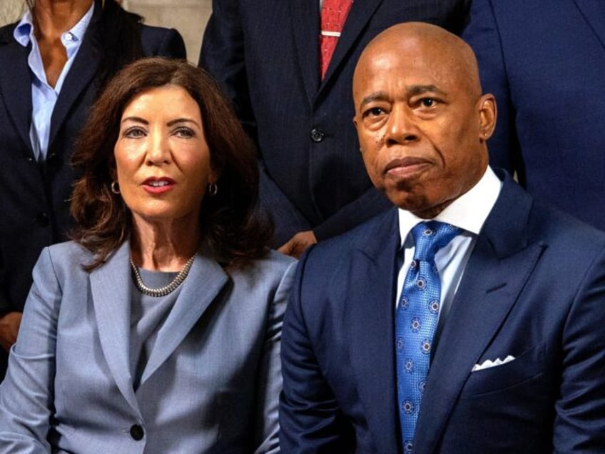 Mayor Eric Adams seated next to New York Governor Kathy Hochul are pictured during press c