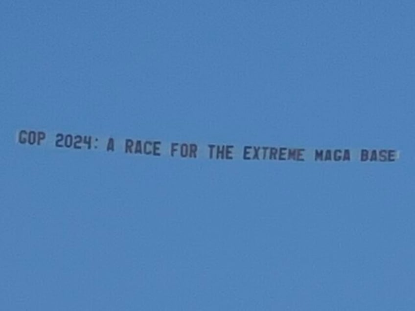 democrats troll republican debate with banner attacking maga base