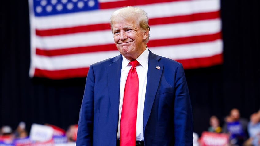 Donald Trump closeup shot, US flag behind him